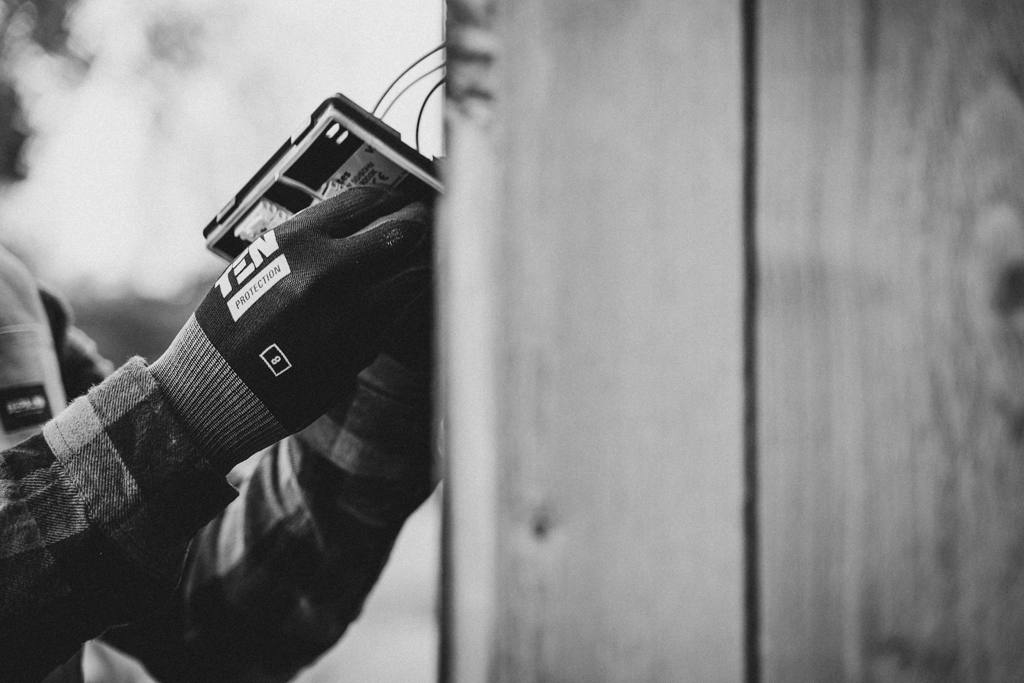A person holding a device with wire