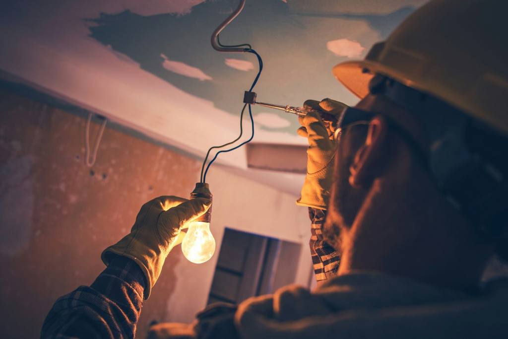 Electrician working on a bulb