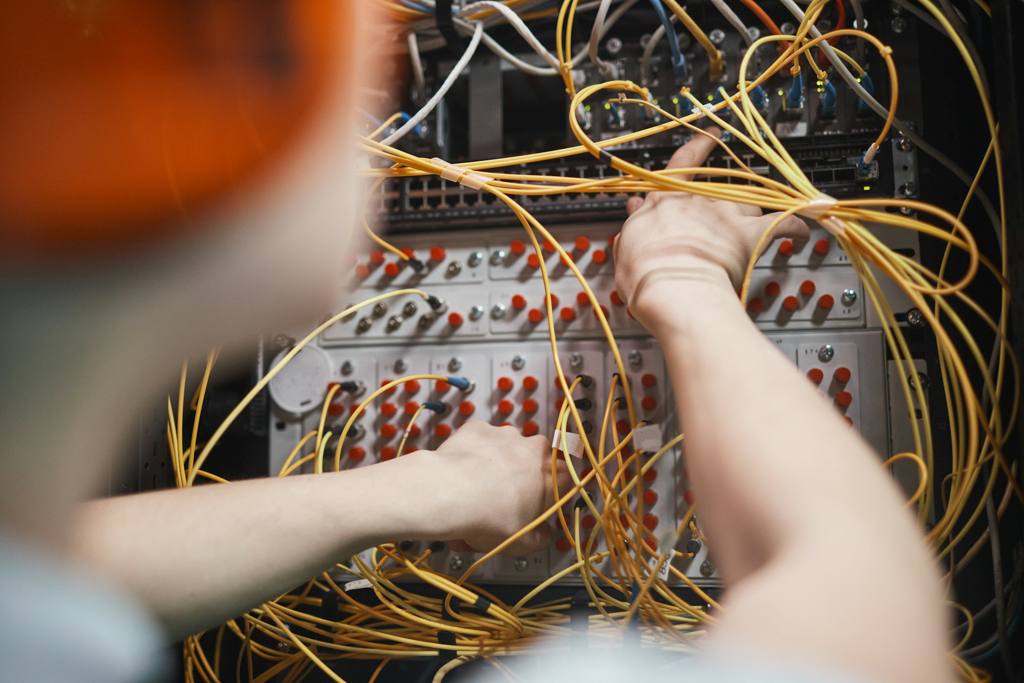 A person fixing wires
