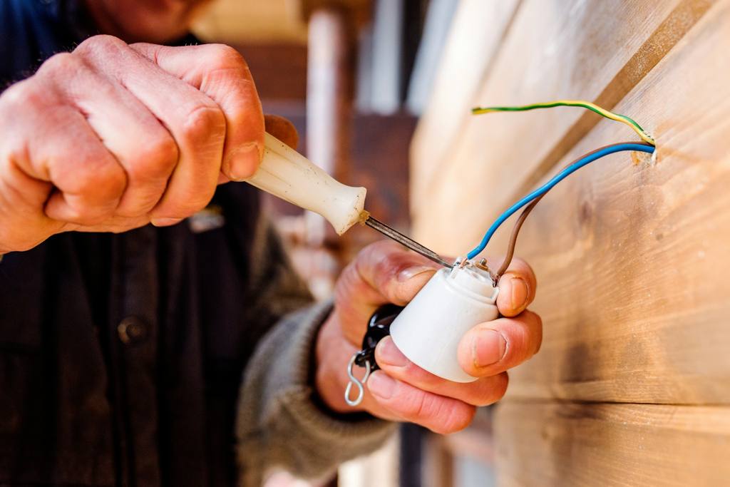 Person holding a hand tool
