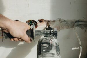 A person is working on an electrical wires