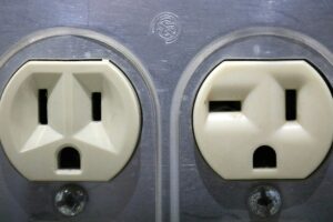 Couple of white electrical outlet