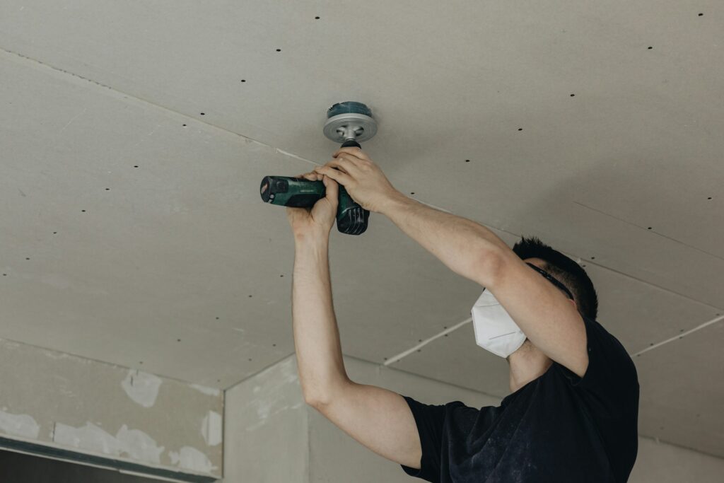 Man working on a ceiling