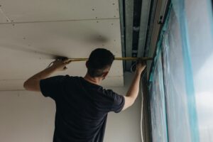 Man working on a ceiling