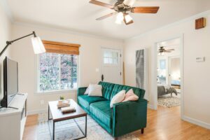 A photo of a living room with a brown ceiling fan