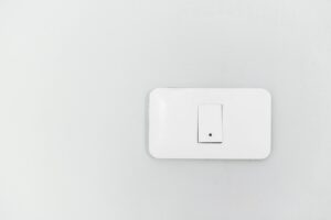 A white switch on a wall