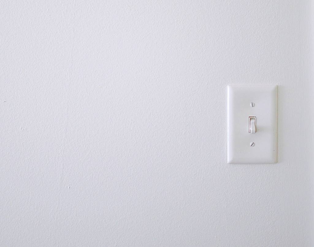 A white wall with light switch