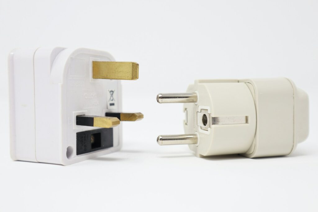 Two white power adapters