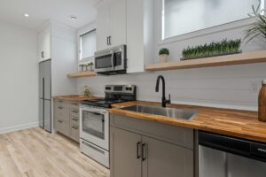 A kitchen with white cabinets