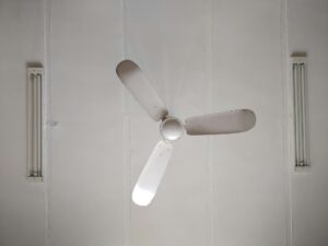 A photo of a white ceiling fan