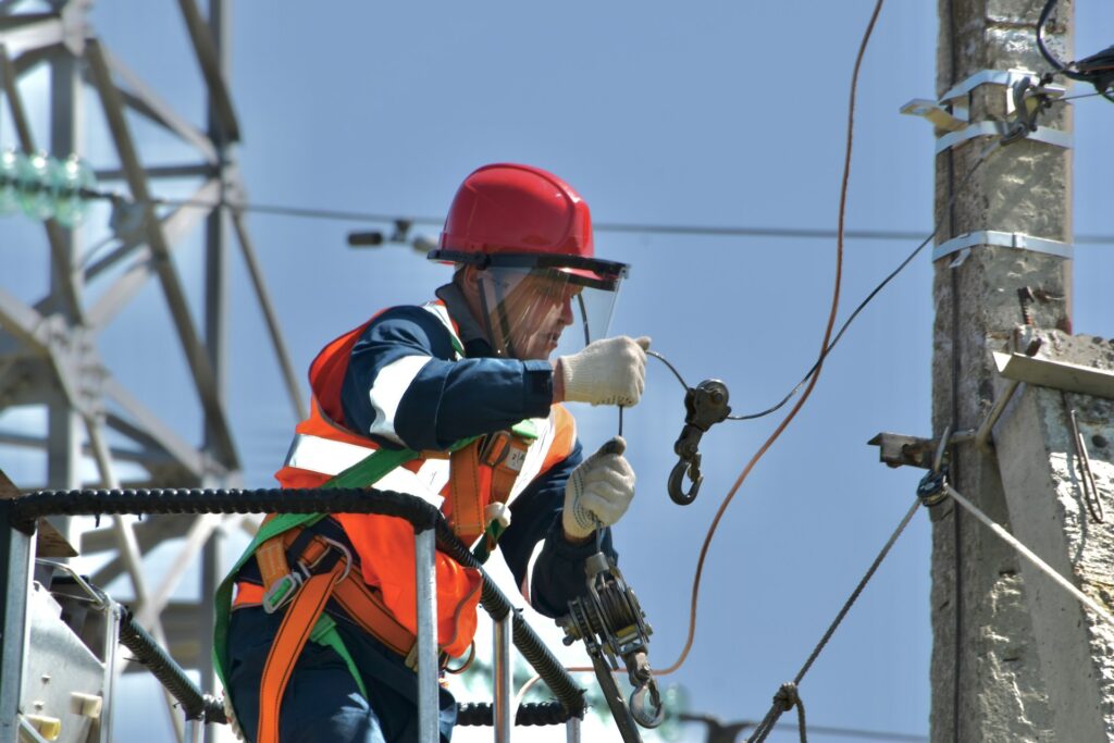 An electrician working on cable lines