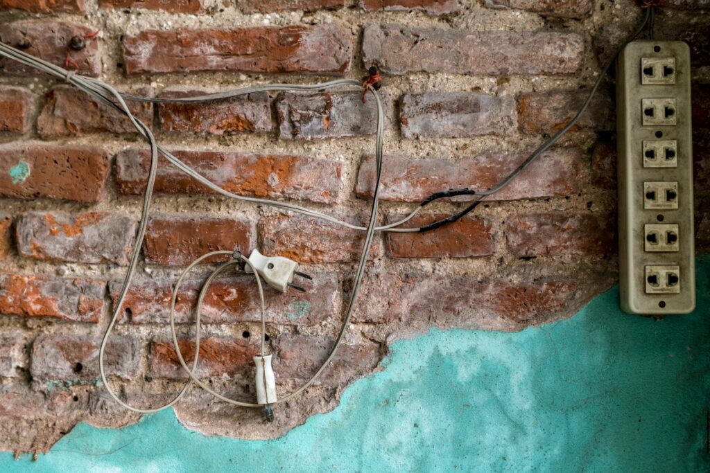 Power Plug hanging on a wall